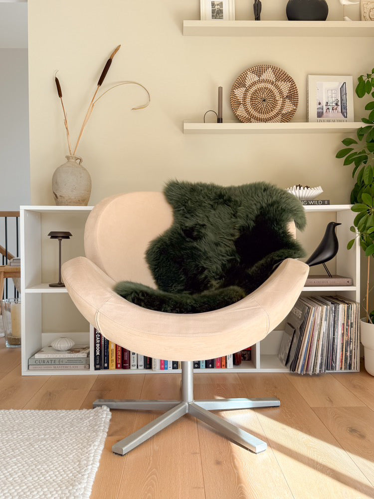 Luxury natural green sheepskin throw on accent chai
