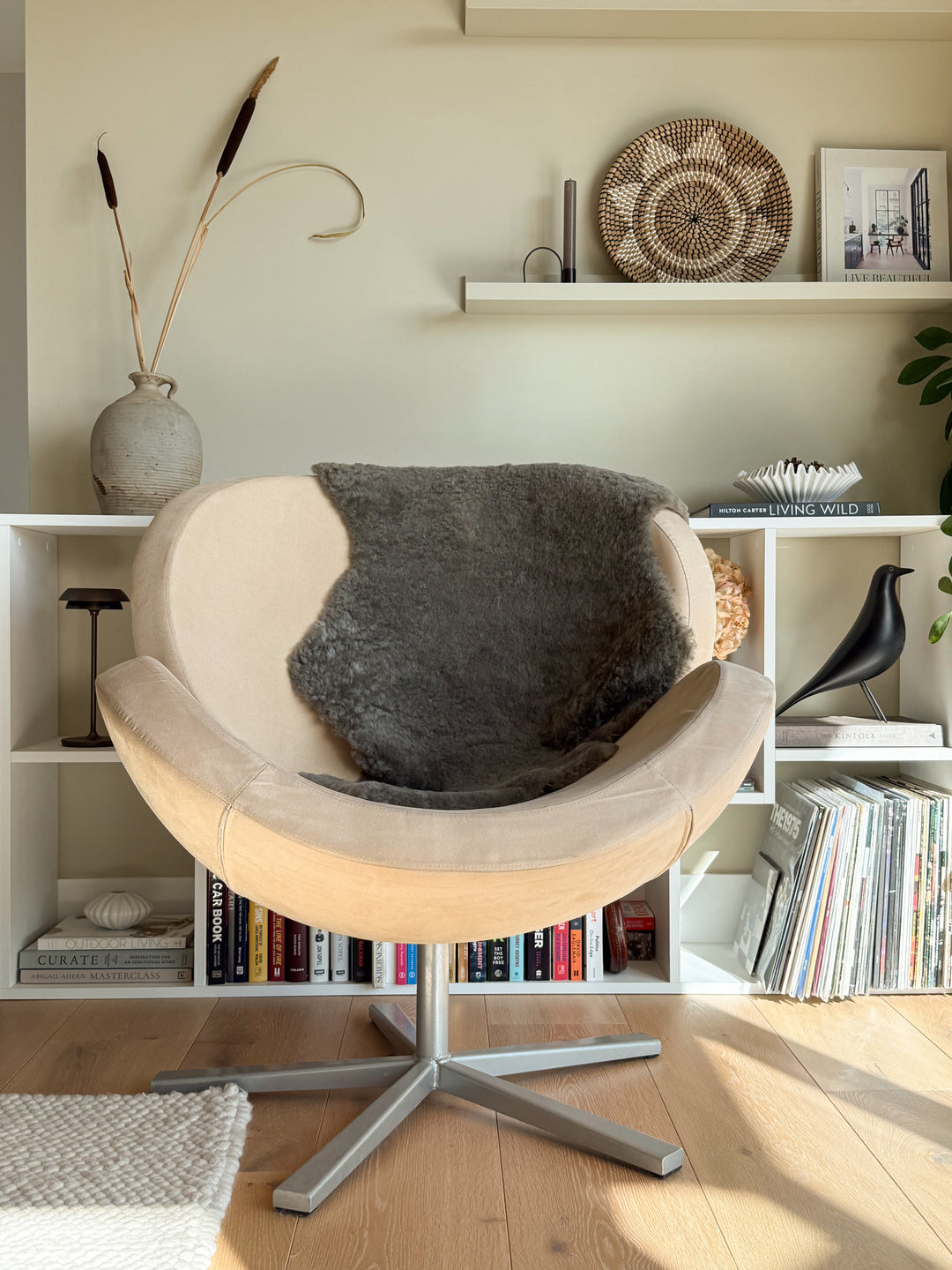 Taupe sheepskin rug on chair